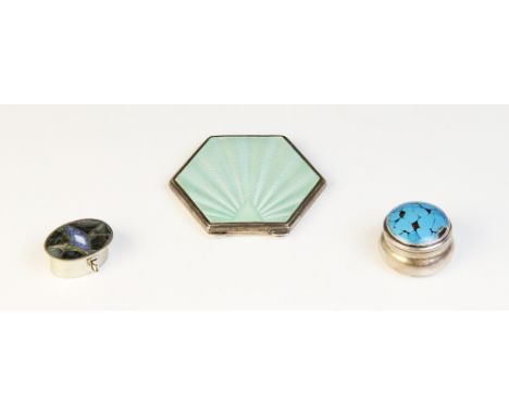 An Art Deco silver and enamel compact by Adie Brothers, Birmingham 1933, of hexagonal form with green guilloche enamel decora