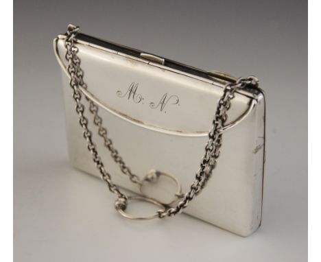 A George V silver purse, Henry Matthews, Birmingham 1919, of rectangular form, spring cover to front revealing gilt interior,