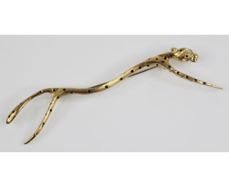 An 18ct gold cheetah brooch by Naomi Schwartz, the stylized Cheetah body with black enamel spots and fur effect chasing, with