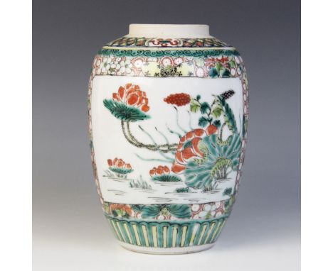 A Chinese famille verte ginger jar, Kangxi style, 19th century, the cylindrical jar externally decorated with two reserves of