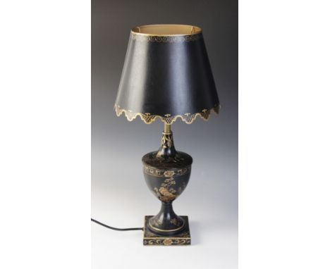 A Regency style toleware lamp base, the urn shaped body decorated with floral, foliate and scroll motifs, with original metal