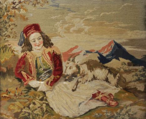 A continental tapestry depicting a young lady in traditional dress with a goat and mountains beyond, framed and glazed, 65.5c