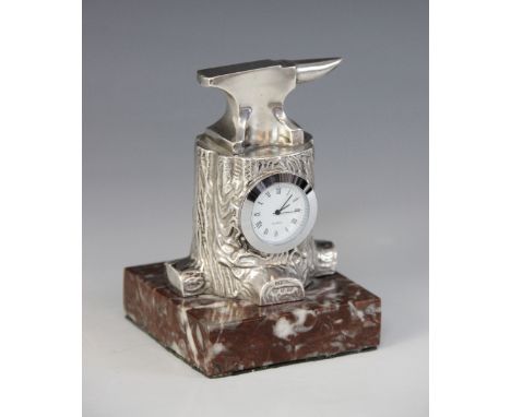 A late Victorian novelty silver mounted timepiece, Douglas Clock Co, Birmingham 1898, modelled as an anvil upon a tree stump,