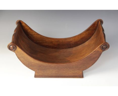 A 19th century style mahogany cheese coaster, of typical crescent form, applied with moulded roundel detail, 41cm longConditi