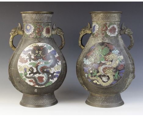 A pair of Chinese cloisonné inset Archaic style vases, 19th century, each of Hu-type form with beast mask lugs and set to eac