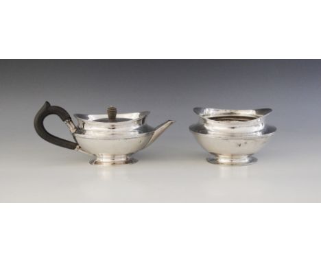 A 19th century Dutch silver teapot and sucrier, stamped 'ICH' with retailers mark for 'DIEMONT', each of compressed form on c