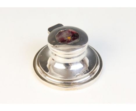 A George V silver mounted miniature capstan inkwell, possible Henry Matthews, Birmingham 1911, of typical form, the cover dec