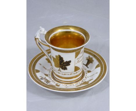 A French Empire ceramic gilt cabinet cup and saucer, leopard head handle, H.11cm