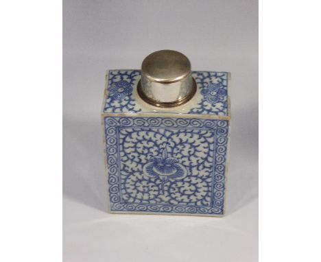 A glazed blue and white ceramic flask with white metal lid,