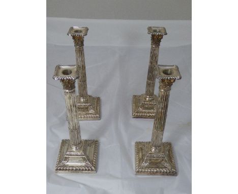 Set of 4 Victorian candlesticks of corinthian column form, hallmarked London, 1874, by Henry Wilkinson, weighted bases, H.33c