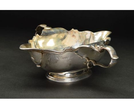 A VICTORIAN SILVER TWIN HANDLED DOUBLE LIPPED SAUCE BOAT, of shaped rectangular form with wavy rim, on a stepped oval base, m