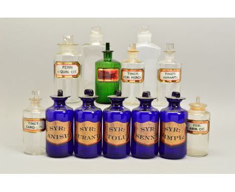 A SET OF FIVE 20TH CENTURY BLUE GLASS PHARMACY JARS AND STOPPERS, each with a gilt cartouche with red outline and black lette