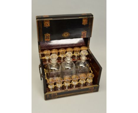 A 19TH CENTURY FRENCH EBONISED, TORTOISESHELL AND BRASS INLAID TABLE TOP LIQUEUR BOX, of domed form, hinged lid and hinged si