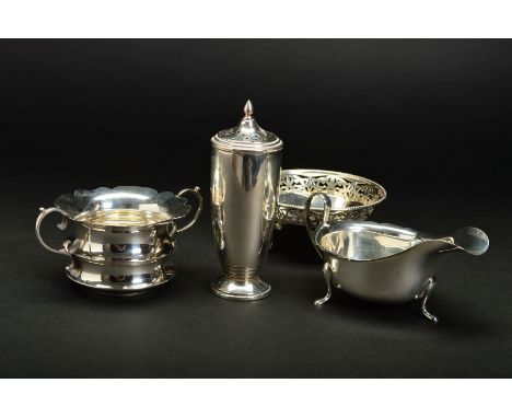 A GEORGE V SILVER CIRCULAR BON BON DISH, beaded rim above a border pierced with foliate scrolls and panelled base, on four op