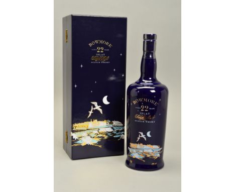A BOTTLE OF BOWMORE BLUE BUCHAN ISLAY SINGLE MALT, aged 22 years, 43% vol. 70cl, in a blue ceramic decanter and in a beautifu