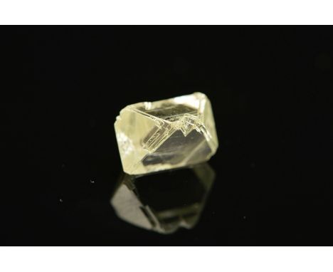 A ROUGH ELONGATED OCTAHEDRAL DIAMOND CRYSTAL, colour assessed as colour M, measuring approximately 7.4mm x 6.4mm x 4.9mm, wei
