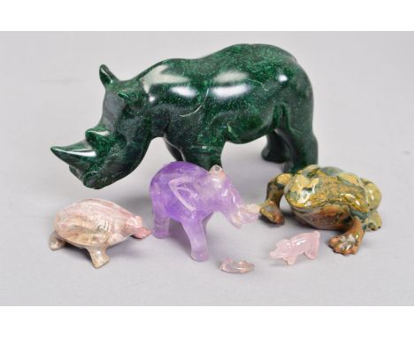 A SELECTION OF CARVED ANIMALS, to include a carved rhino, assessed as green type jasper, measuring approximately 14cm x 7.5cm