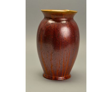 A PILKINGTON ROYAL LANCASTRIAN BALUSTER SHAPED VASE, decorated in a gold adventurine glaze over treacle, impressed with backs