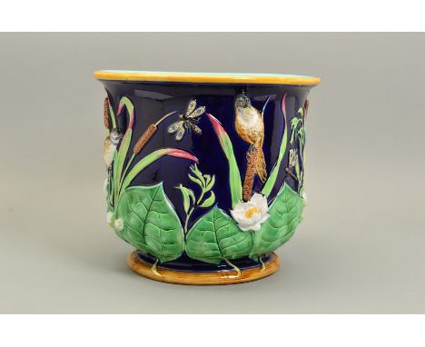 A VICTORIAN GEORGE JONES MAJOLICA JARDINIERE, of circular form, moulded with birds and dragonflies amongst bullrushes and wat