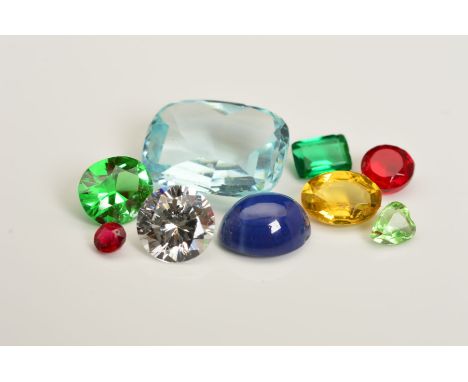 A LARGE COLLECTION OF SYNTHETIC, COMPOSITE AND PASTE STONES, to include sapphire, ruby, GTD's, emerald, opal and a spinel bou