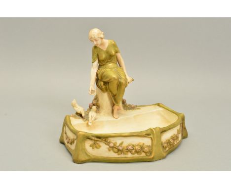 AN ART NOUVEAU ROYAL DUX TABLE CENTREPIECE, circa 1900, modelled as a maiden seated feeding two doves before a semi-circular 