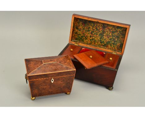 AN EARLY 19TH CENTURY AMBOYNA TEA CADDY, of sarcophagus form, the hinged lid covering the two compartments with turned bone f