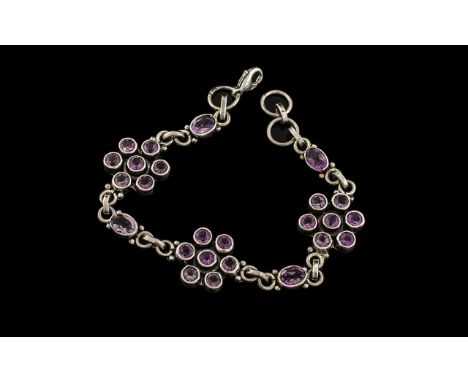 Ladies Sterling Silver Amethyst Set Stylised and Well Made Bracelet of Attractive Form. Trio of Flower head Setting with Spac