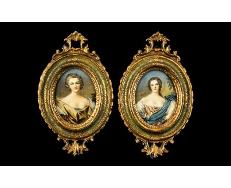 Pair of Miniatures Painted on Ivory of Elegant Ladies, finely dressed in silks, signed Esposti; housed in carved, gilt wood, 