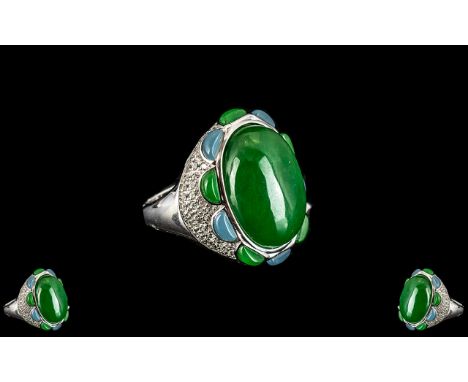 Green and Blue Jade Statement Ring, an oval cut green jade cabochon of 22cts, framed with alternate D cut cabochons of green 