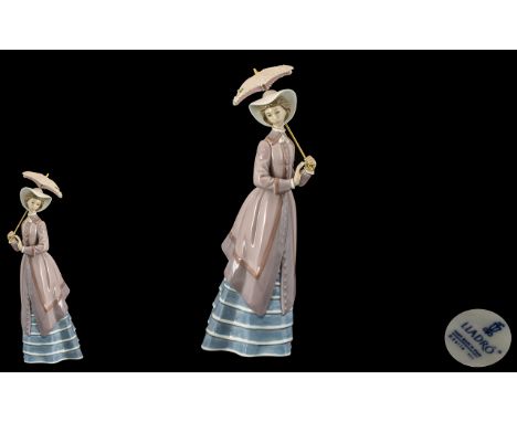 Lladro - Pleasing Hand Painted Porcelain Figure ' Parisian Lady ' with Parsol. Model No 5321. Issued 1985 - 1995. Height 10.7