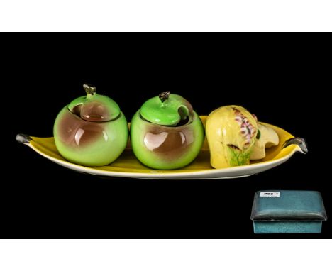 Carltonware - Eight assorted small pieces including a covered oblong box, a banana dish, salt pot, two small apple pots with 