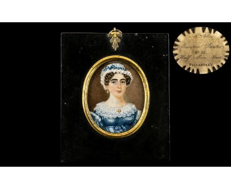 19th Century Oval Miniature Portrait of a lady in a blue dress, painted on ivory; verso 'Mrs Miller - Miniature Painters, No.