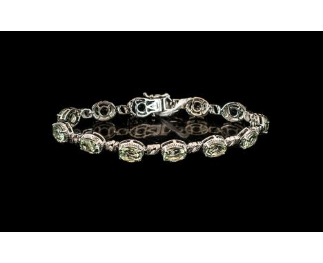Green Amethyst Tennis Bracelet, 12 oval cut sparkling, mint green amethysts, also called prasiolite, totalling 20cts, set in 