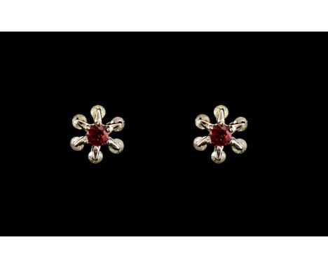 Floral Shaped Earrings  with Diamond Chips and ruby centre stones, for pierced ears.