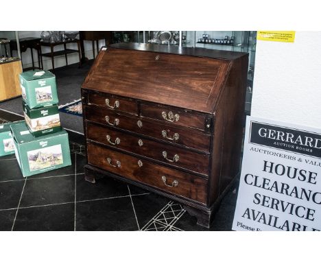 A Walnut George III Bureau with full front, fitted interior with various pigeon holes, central cupboard, and hidden inserts. 
