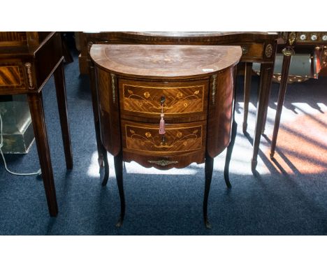 A French Demi Lune Two Drawer Inlaid Commode, chest of traditional form with small ormolu mounts, supported on delicate cabri