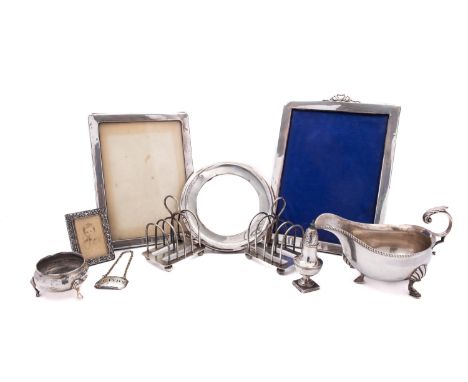 A mixed group of silver including; a large silver photograph frame by Henry Matthews, Birmingham date letter rubbed, internal
