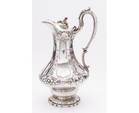 A large Victorian silver hot water jug by Henry Holland, London 1854, of canted baluster form, hinged domed lid, foliate fini