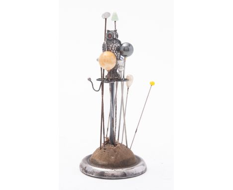 A George V silver Owl hat pin stand by Arthur Johnson Smith, Birmingham 1925, the Owl with one red eye, group of hat pins, 12