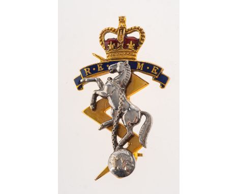 Garrard &amp; Co. A 9ct gold and enamel British Army badge and one other 9ct gold British Army badge, including a Garrard &am