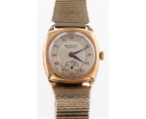 Buren Grand Prix a 9K gold wristwatch the round two-tone silvered dial having black Arabic numerals, blue steel  hands, a swe
