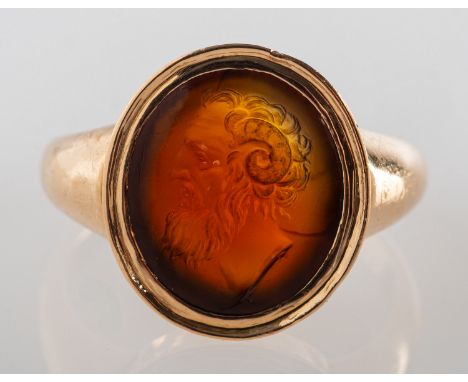 An antique carved intaglio ring, an oval carved plaque, depicting a gentleman's bust, possibly Serapis Ammon with ram's horns