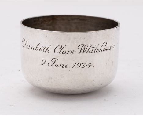 A George V Arts and Crafts silver christening tumbler cup by A. E.Jones, Birmingham 1933, hammered design, engraved Elizabeth