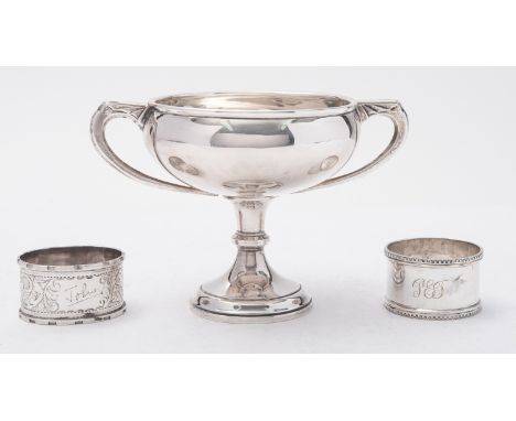 A George V silver two-handled cup by Adie Brothers Ltd., Birmingham 1932, no inscription and two napkin rings, 170gms., (5.4o