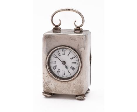 A Victorian silver travelling clock by Henry Matthews, Birmingham 1899, of rectangular form, with swing handle, 8.5cm. (3.3in