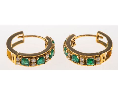 A pair of emerald and diamond half hoop earrings, each hinged hoop earring is set to the front section with rows of two brill