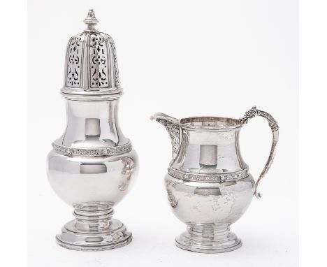 A George V silver sugar caster and cream jug by Adie Brothers Ltd, Birmingham 1934, of bulbous vase shape, with Celtic band- 