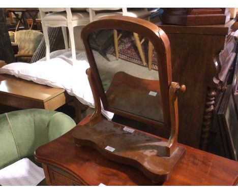 A Victorian dressing table mirror with domed top on serpentine base (damage to frame) (49cm x 46cm x 19cm)