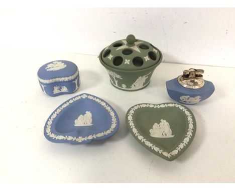 A collection of blue and green Wedgwood jasparware including spade and heart trinket dishes, table lighter, lidded pot and po