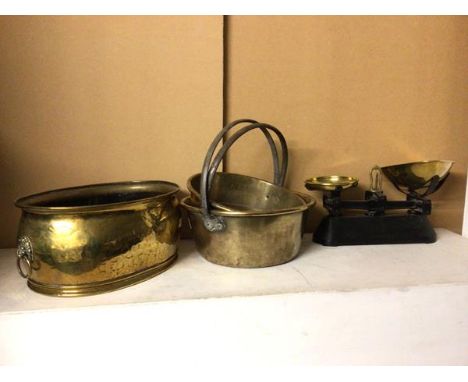 A brass jardiniere with lion mask handles to sides (17cm x 36cm x 28cm), two brass pans with fixed handles and a set of shop 